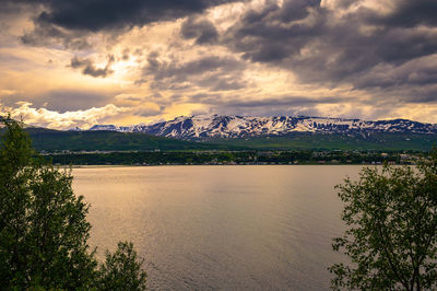 Scenic view of lake against sky during sunset