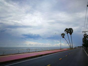 View of beach against cloudy sky