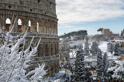 Coliseum against sky during winter