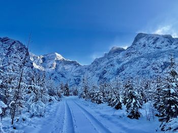 Scenic view of snowcapped mountains against sky