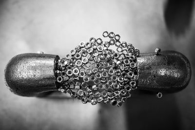 Close-up of chain against wall