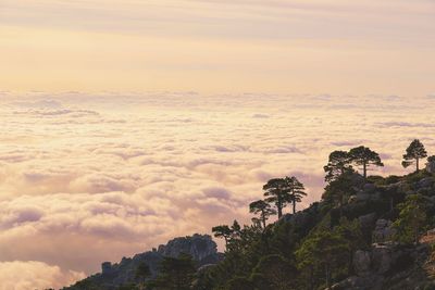 Scenic view of rock formation against sky during sunset