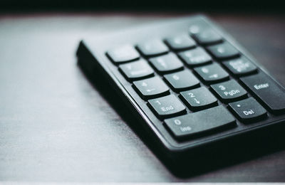 Close-up of computer keyboard on table at office