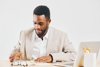 Young man working at desk in office