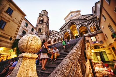 Newel post of staircase with church in background