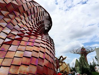 Low angle view of built structure against cloudy sky