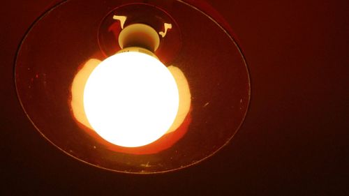 Low angle view of illuminated light bulb