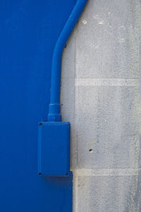 Close-up of blue metal on wall