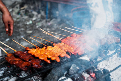 High angle view of meat on barbecue grill