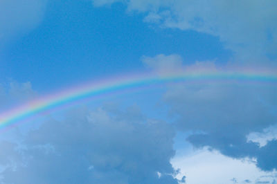 Low angle view of rainbow in sky