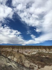 View of landscape against cloudy sky