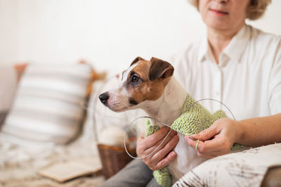 Midsection of woman with dog