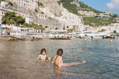 Two girls  swimming in sea