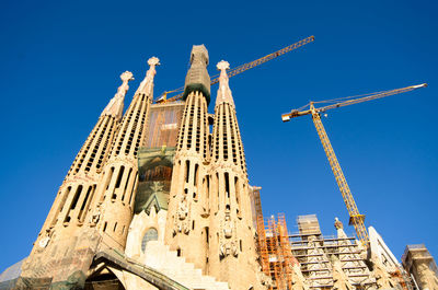 Low angle view of building against blue sky