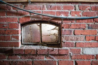 Close-up of window on brick wall
