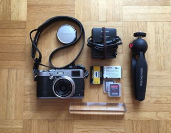 Directly above shot of camera and equipment on table