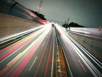 High angle view of light trails on highway at night