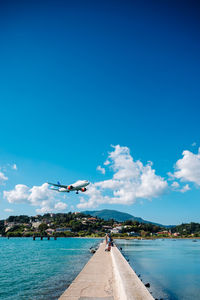 Scenic view of sea against blue sky