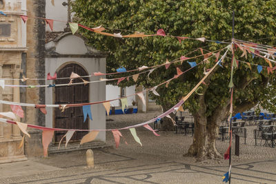 Multi colored rope hanging in park against building