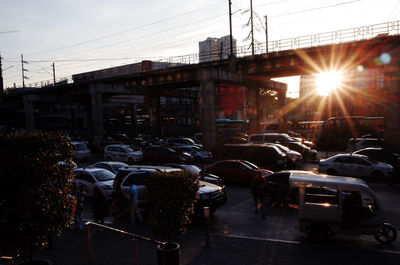 Cars parked in front of building against sky