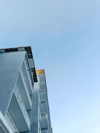 Low angle view of modern building against clear blue sky