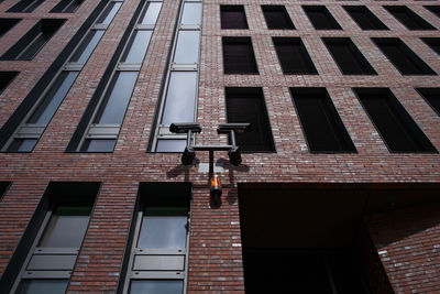 Low angle view of street light against building