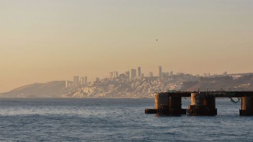 View of ship in sea at sunset