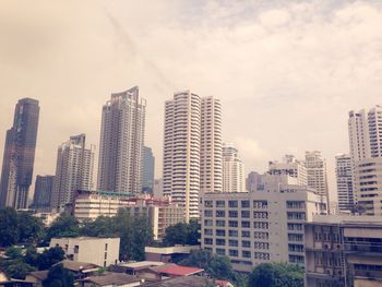 Skyscrapers in city against sky