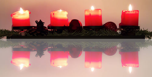 Close-up of candle in darkroom