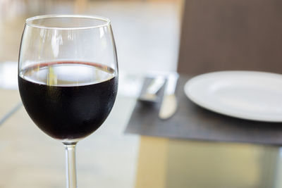 Close-up of beer glass on table