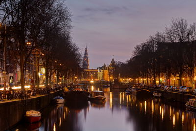 Illuminated city at sunset