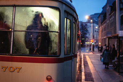 Cable car on street in city at night