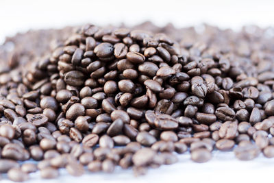 Close-up of coffee beans on table