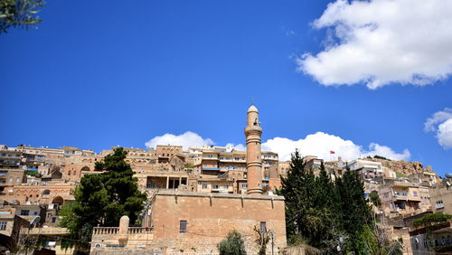 Buildings in city against sky