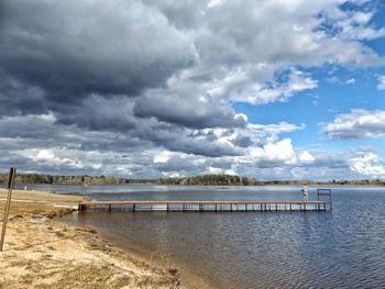 Scenic view of sea against storm clouds