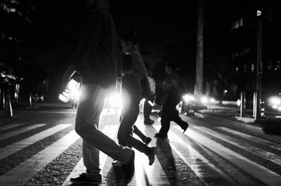 Blurred motion of people on road at night