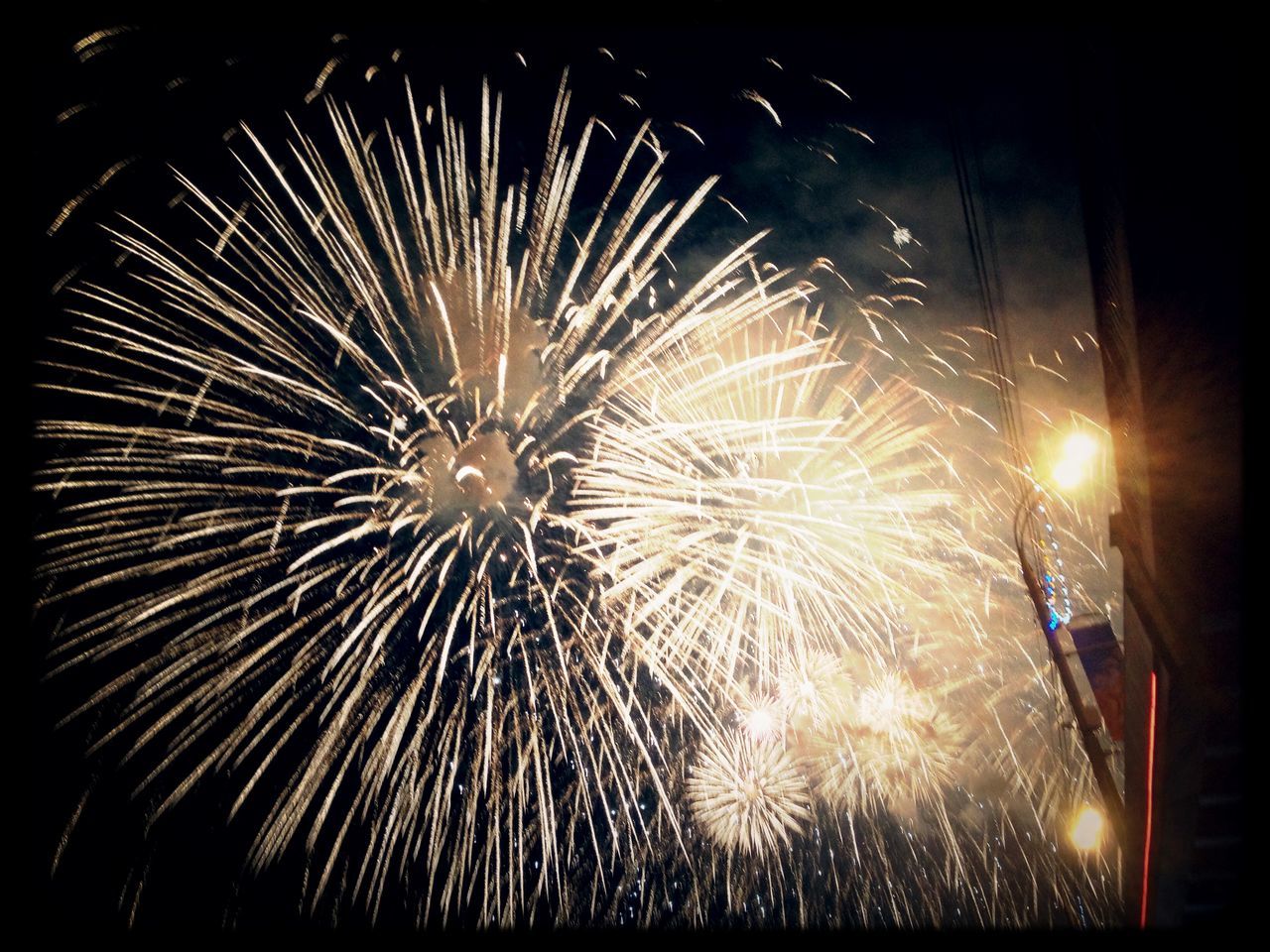 night, illuminated, firework display, celebration, glowing, exploding, firework - man made object, sparks, long exposure, arts culture and entertainment, motion, event, fire - natural phenomenon, entertainment, firework, blurred motion, low angle view, celebration event, sky, lighting equipment