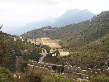 Scenic view of landscape and mountains against sky