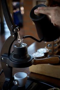 Cropped hand of woman holding coffee