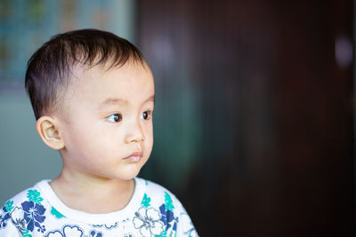 Portrait of cute boy looking away