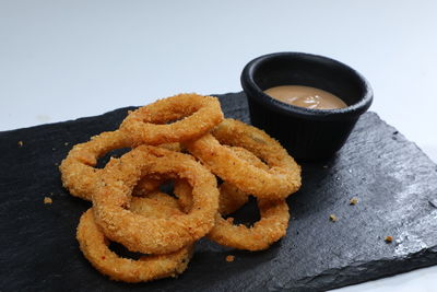 Close-up of serving food on table