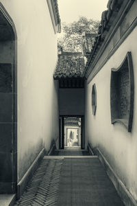 Empty alley amidst buildings