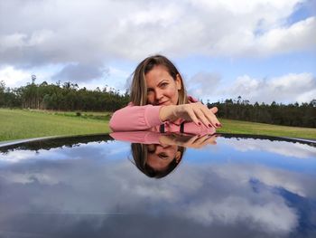 Portrait of a smiling young woman in swimming pool