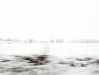 Scenic view of lake against clear sky during winter