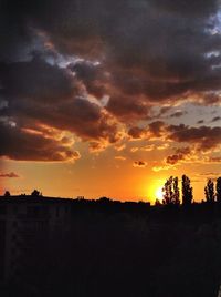 Silhouette of landscape against dramatic sky