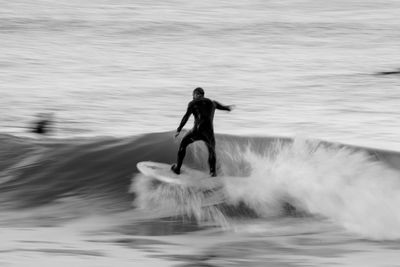 Full length of man surfing in sea