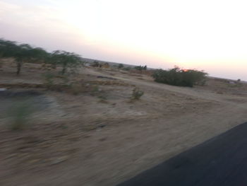 Scenic view of landscape against sky during sunset