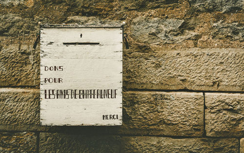 Close-up of text on wall
