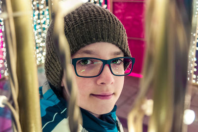 Portrait of boy wearing eyeglasses and knit hat
