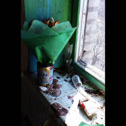 High angle view of broken window in abandoned building